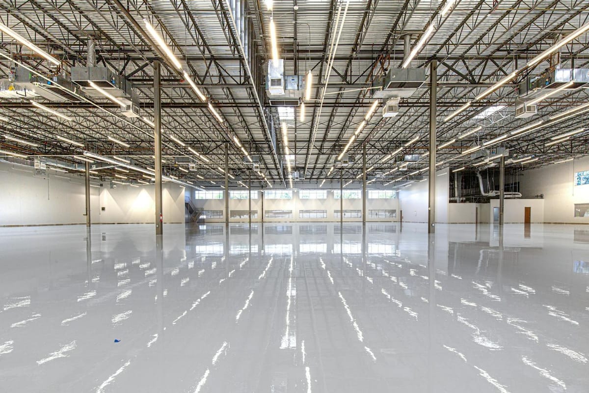 Illustrative example of a high-gloss polyaspartic-coated floor in an industrial space